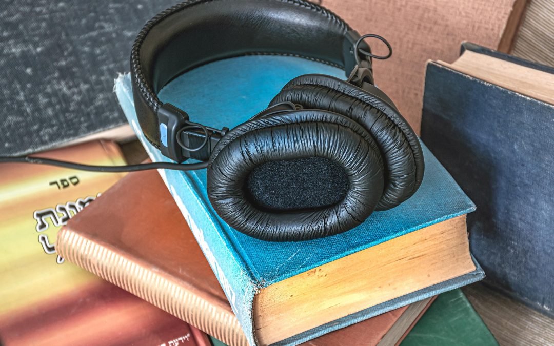 Headphones on a stack of books